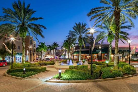 Palm-lined Main Street in Lakewood Ranch illuminated at dusk